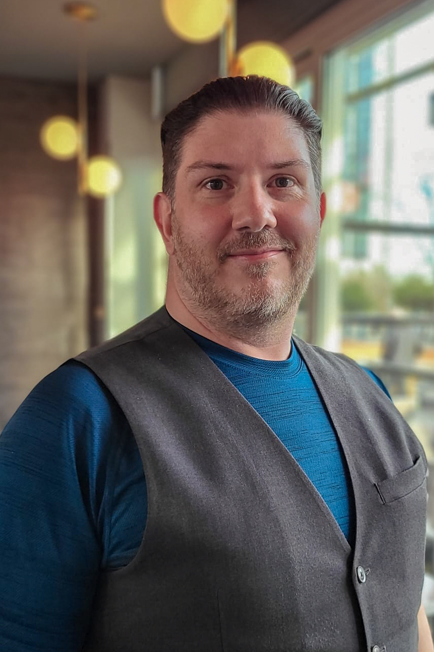 Placeholder for a professional headshot of Emrys Horton